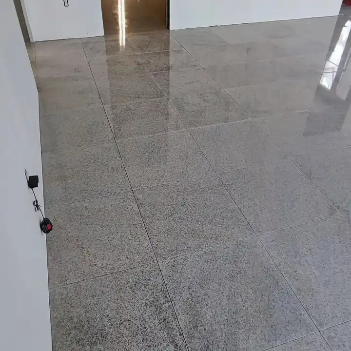 Close view of a polished porcelain floor with tight grout lines